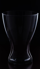glass on a black background, vase