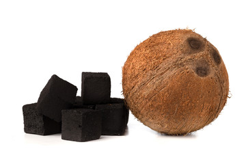 Coconut charcoal on a white background. Coconut coal cubes for hookah and coconut close-up.