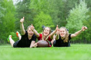 Cheerful female rugby players celebrating