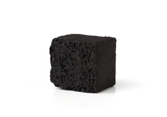 Coconut charcoal on a white background. Coconut coal cubes for hookah close-up.