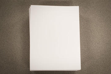 Stack of blank paper on desk