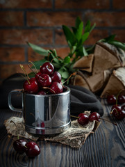 Fresh cherries in a cup.