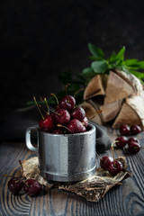 Fresh cherries in a cup.