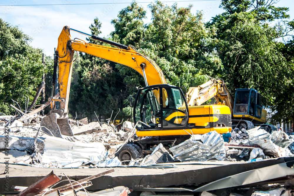 Wall mural stones, destroyed buildings, building. demolition. a pile of stones. crane