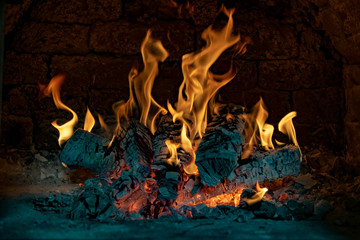 The mesmerizing flames of a beautiful fire in rustic brick ovens.