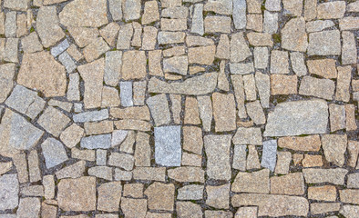 Old road paved with granite stones.