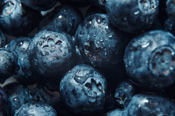 Nature background. Summer, spring concepts. Fresh blueberry background. Macro view of abstract nature texture and background organic pattern. Copy space. Macro shot. Texture blueberry berries close-up