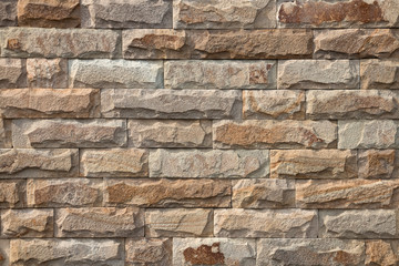 Beige brick wall made of natural stone