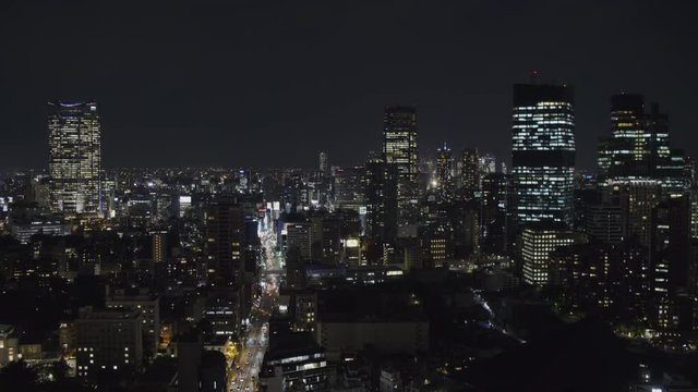 Wide Static Night shot of Minato city in Tokyo with traffic, Japan from Tokyo Tower