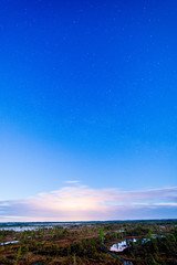night sky with stars and clouds in long exposure shot