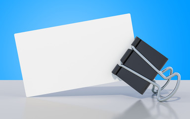 Blank business card with binder clip on the table, 3D rendering