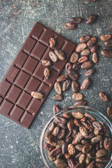 Dark chocolate bar and cocoa beans.