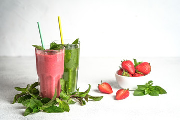 Organic berry and vegetable smoothie with oatmeal on a light background. Healthy food. Lactose free diet.