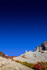 Wonderful view at Torres del Paine National Park in golden Autumn and hikers, Patagonia, Chile