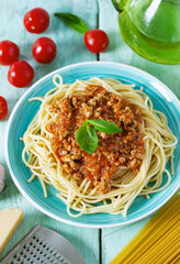 spaghetti bolognese on wooden surface