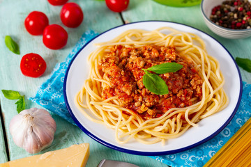 spaghetti bolognese on wooden surface