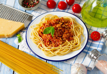 spaghetti bolognese on wooden surface