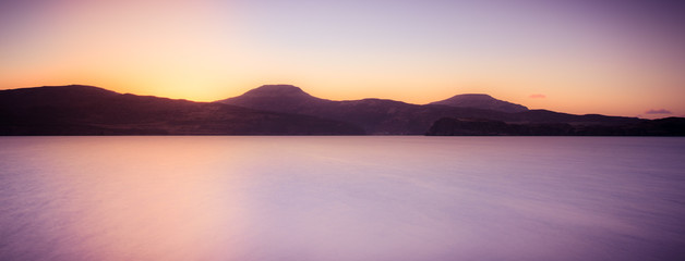 Isle of Skye landscape - sunset over ocean and mountains