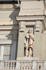 architectural detail of a baroque church window and pilasters sculpture