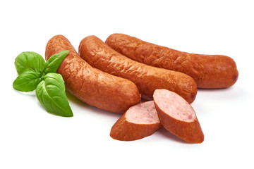Oktoberfest Smoked pork Sausages with basil leaves, close-up, isolated on white background