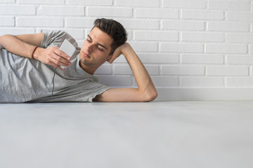 young on the floor of home with mobile phone