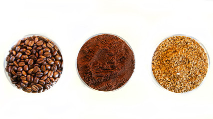 Three types of Arabica coffee in one picture: roasted beans, ground and instant granulated. In round glass bowls on a light background