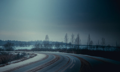 Russian asphalt road in winter. winter road.
