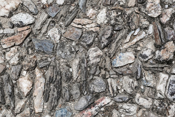Background of ancient road paved with cobblestone