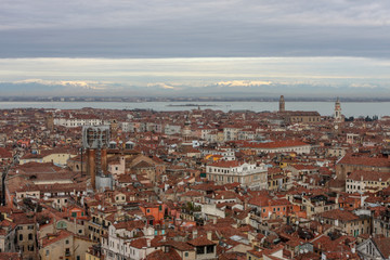 Fototapeta na wymiar Red roofs of Venice. Old european city background. Aerial view of the rooftops of Venice., Italy