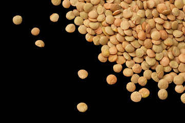lentils isolated on black background. top view