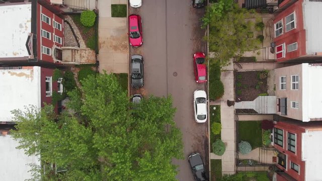 Chicago Neighborhood aerial drone street summer cars parking rising