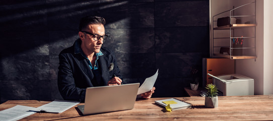 Businessman reading a resume for a job interview