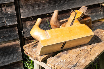 Planes on a vintage board, top view, Retro hand tools. Traditional woodworking. Copy space