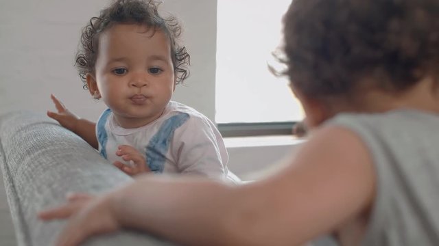 Baby friends playing at home, cute moment 
