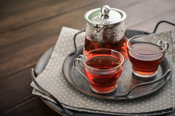 Two glass cup of tea with teapot