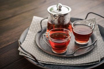 Two glass cup of tea with teapot