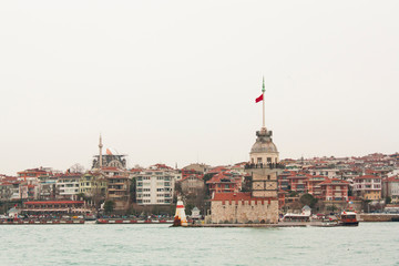 Fototapeta premium Maiden's Tower which is one of the main touristic symbols of the city is located between European and Asian sides of Istanbul, Turkey. 