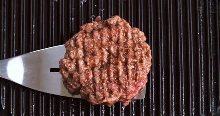 Burger flipped on grill