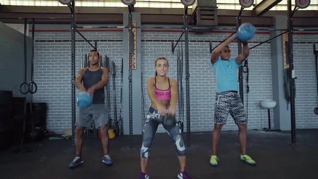 Strong lean healthy people with kettlebell