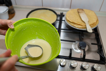 Preparing delicious pancakes on a home kitchen. Delicious delicacies served for dinner at home.