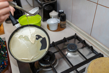 Preparing delicious pancakes on a home kitchen. Delicious delicacies served for dinner at home.