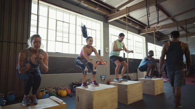 Group of people in crossfit class in gym