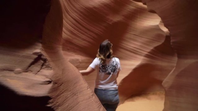 Sandy rocky canyon of Antelope, woman walking