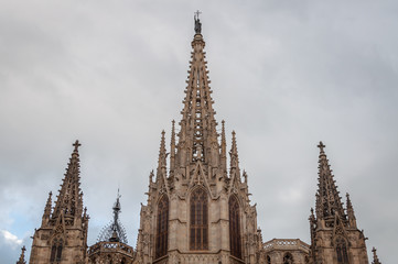 Fototapeta na wymiar Close-up of the monumental high of Santa Creu Cathedral in Barcelona