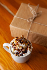 Coffee with a craft wrapped gift for Christmas