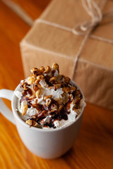 Coffee with a craft wrapped gift for Christmas