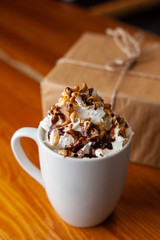 Coffee with a craft wrapped gift for Christmas
