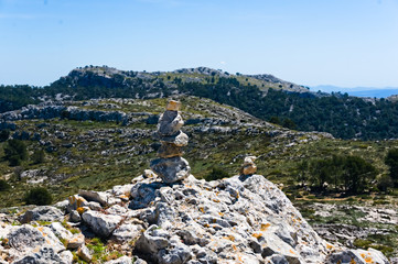 Stack of rocks called a cairn on a mediterranean mountain, tramuntana mountains, mallorca