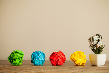 Creative idea concept.Inspiration, New idea and Innovation concept with Crumpled Paper on wood...