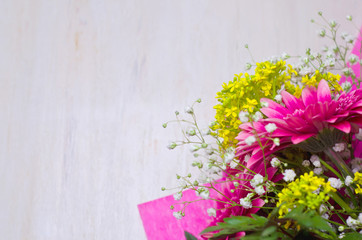 flowers bouquet on wooden background blank for greeting card selective focus